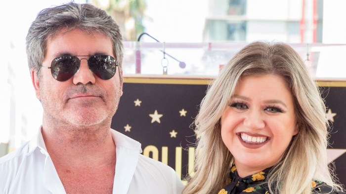 Kelly Clarkson and Simon Cowell attend a ceremony