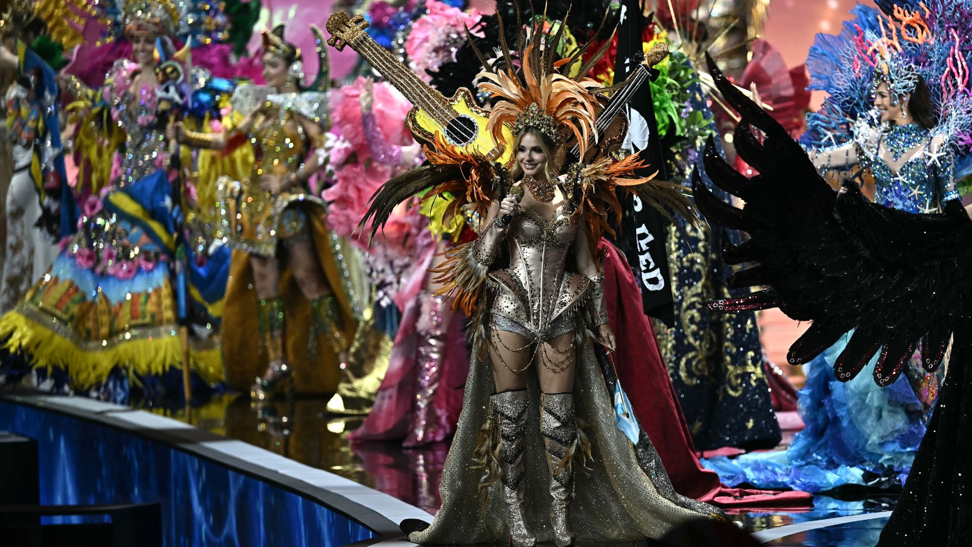 Miss Spain Andrea Valero (C) walks on stage with other contestants during the 2025 Miss Universe national costume presentation in Nonthaburi, north of Bangkok, on November 19, 2025