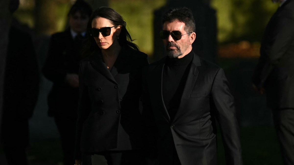 Simon Cowell and Lauren Silverman wearing sunglasses