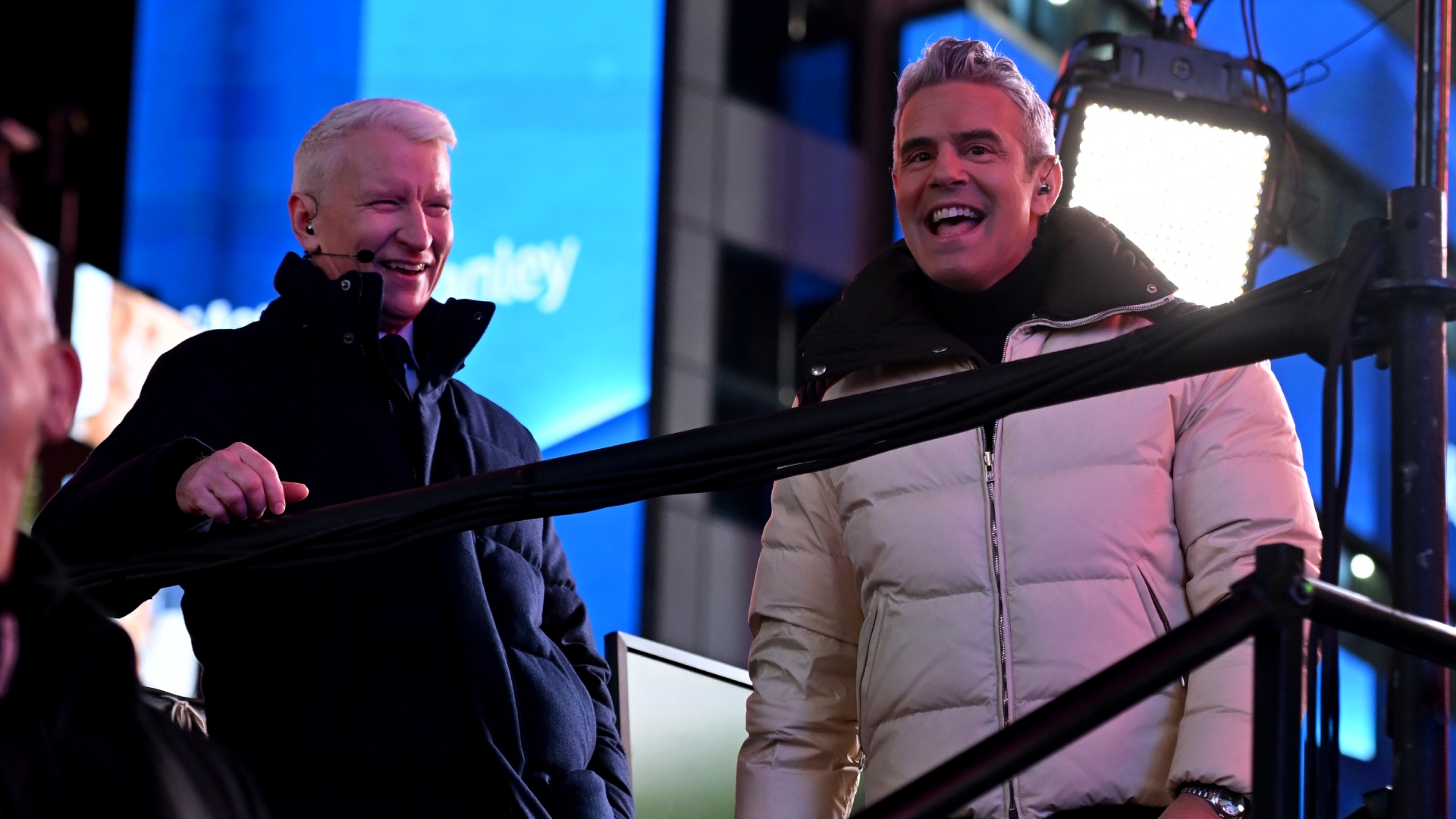 Andy Cohen and Anderson Cooper smiling