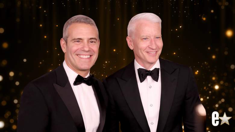 Andy Cohen and Anderson Cooper waring suits and smiling