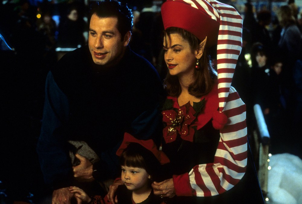 John Travolta, Kirstie Alley and two kids with the Christmas spirit in a scene from the film 'Look Who's Talking', 