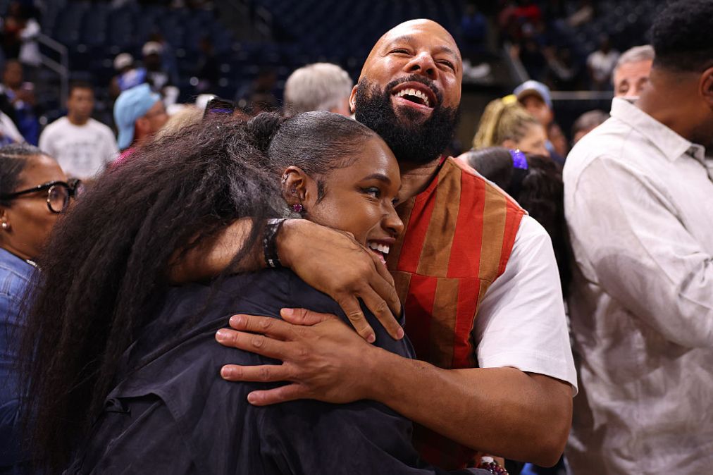 Jennifer Hudson and Common look on after the game between the Chicago Sky and the Las Vegas Aces