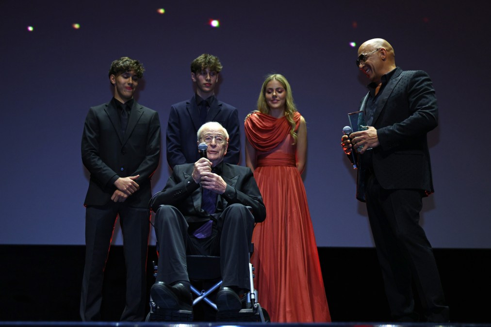 Vin Diesel (R) presents a Honoree Award to Michael Caine (C) 