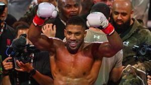 British boxer Anthony Joshua celebrates after defeating US boxer and influencer Jake Paul