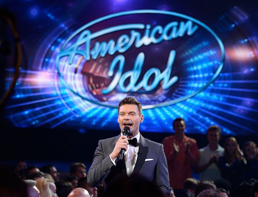 Ryan Seacrest speaks in the audience during FOX's "American Idol" Finale For The Farewell Season