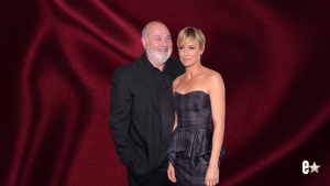 Rob Reiner smiling in black, Robin Wright in strapless plaid dress