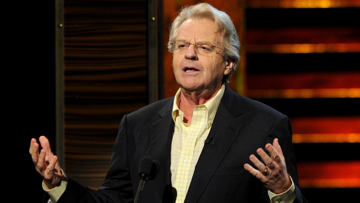 Jerry Springer raising his hands