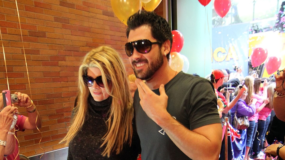 Kirstie Alley and Maksim Chmerkovskiy walking to an interview