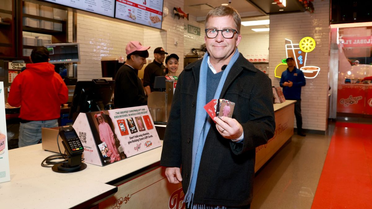 'A Christmas Story' star Peter Billingsley joins Raising Cane's owner and founder Todd Graves in Times Square for annual bike giveaway to Harlem Boys & Girls Club at Miltary Island in Times Square on December 03, 2025 in New York City