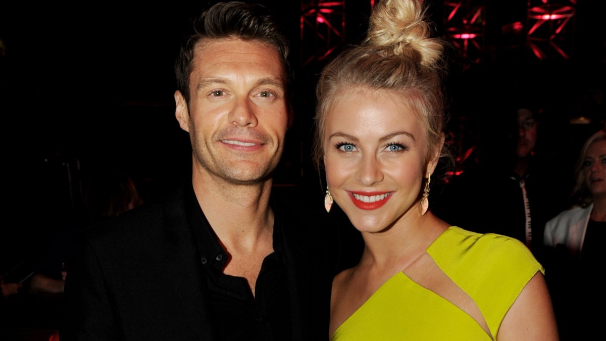 Ryan Seacrest and Julianne Hough smiling at an event