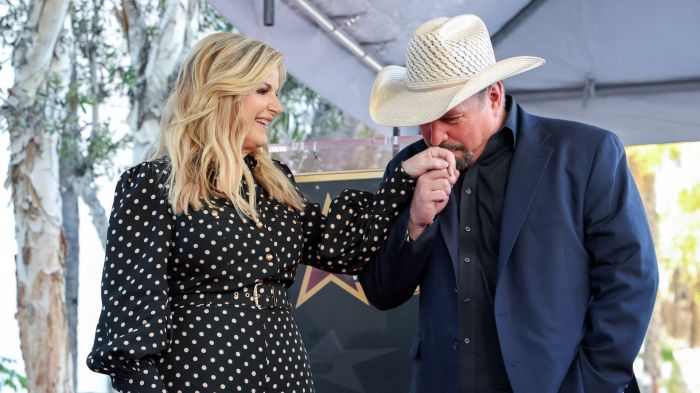 Trisha Yearwood (L) and husband US country singer Garth Brooks pose during her Hollywood Walk of Fame Star Ceremony in front of Capitol Records in Hollywood, California, on March 24, 2025