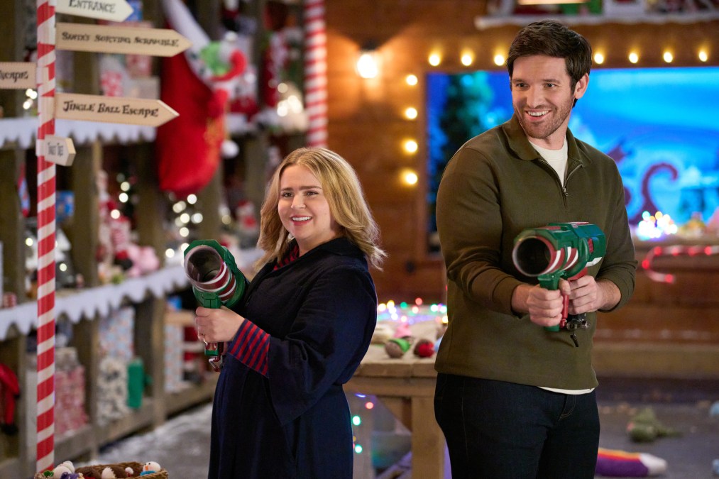 Mae Whitman and Adam Weafer hold toy guns