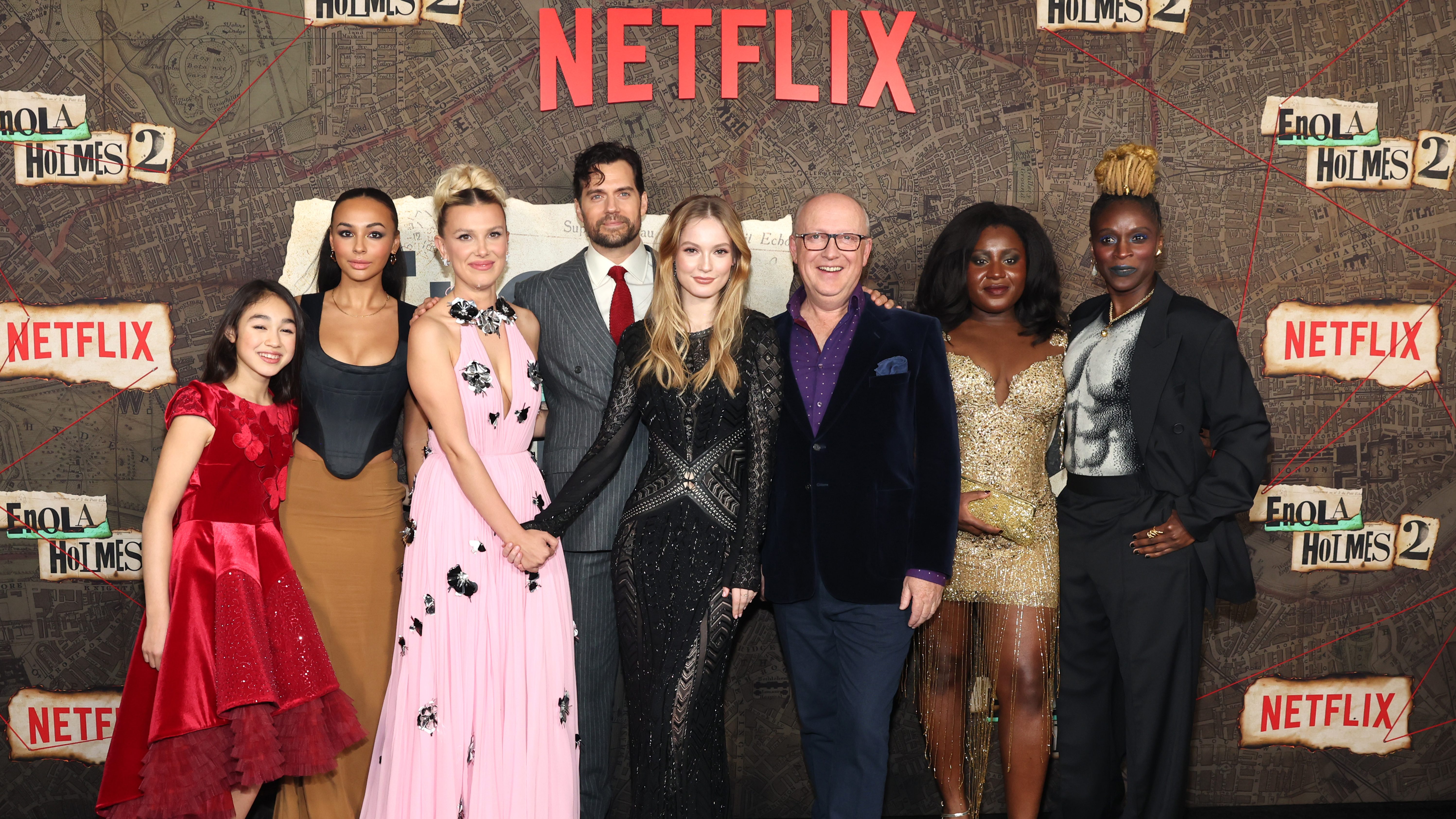 (L-R) Serrana Su-Ling Bliss, Abbie Hern, Millie Bobby Brown, Henry Cavill, Hannah Dodd, Harry Bradbeer, Susan Wokoma and Sharon Duncan-Brewster attend the Netflix Enola Holmes 2 Premiere