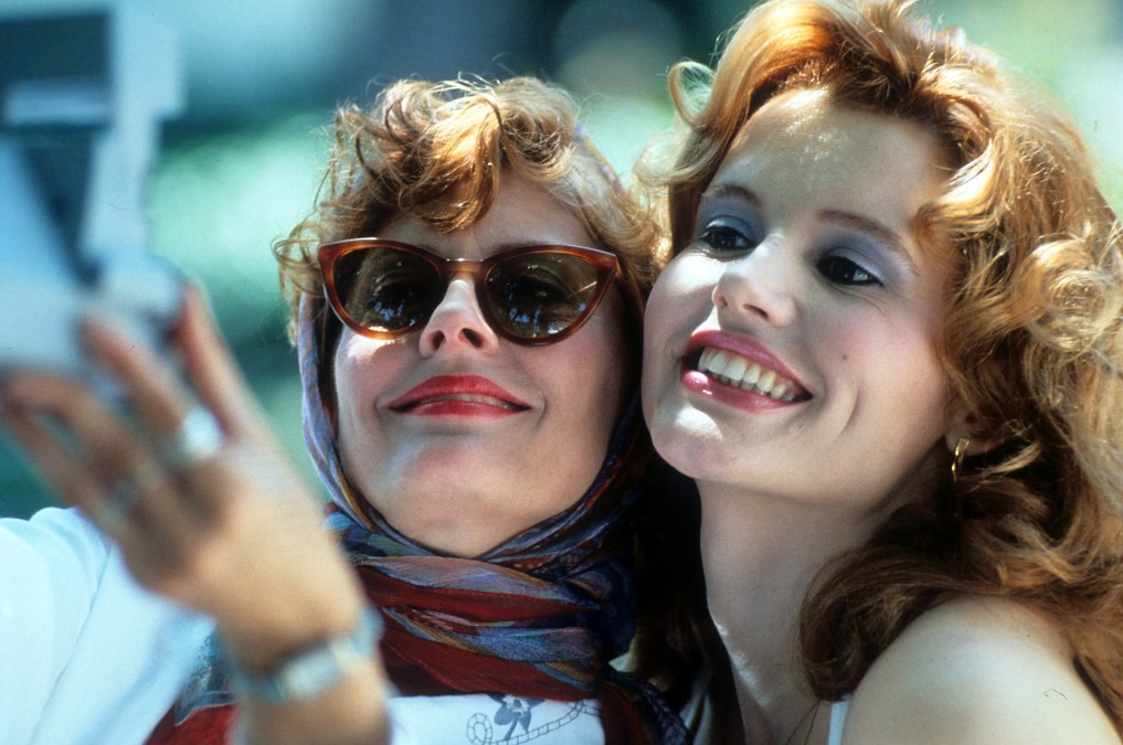 Susan Sarandon and Geena Davis taking Polaroid of themselves in a scene from the film 'Thelma & Louise',