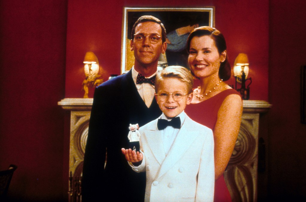Hugh Laurie, Jonathan Lipnicki and Geena Davis pose for a family portrait in a scene from the film 'Stuart Little', 1999.
