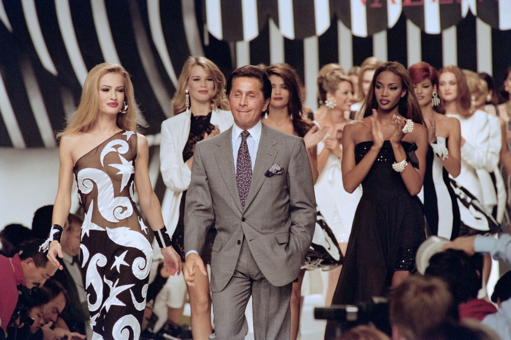 Valentino flanked with models Karen Mulder, Claudia Schiffer and Helena Christensen walking the runway