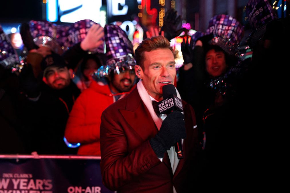 Ryan Seacrest speaks as revelers gather to celebrate New Year's Eve in Times Square