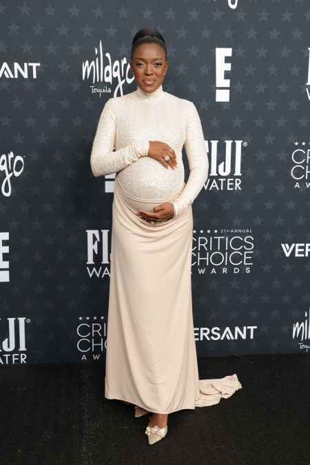 Krys Marshall posing on the red carpet with her baby bump