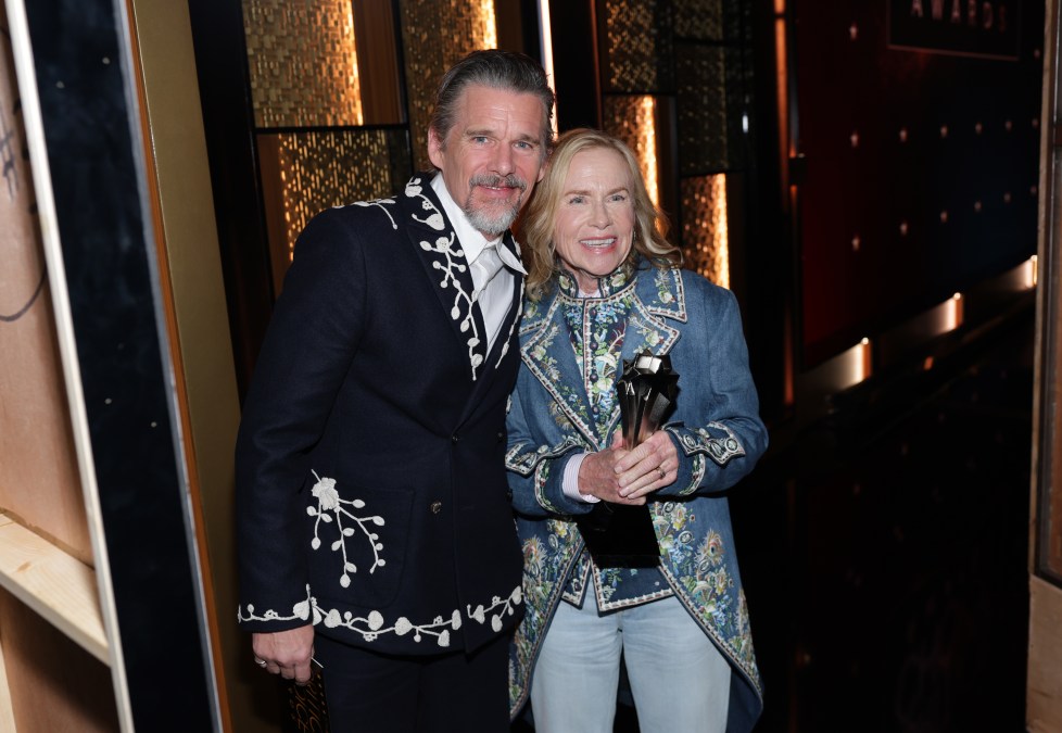 Ethan Hawke poses with Amy Madigan after her Critics' Choice Awards win