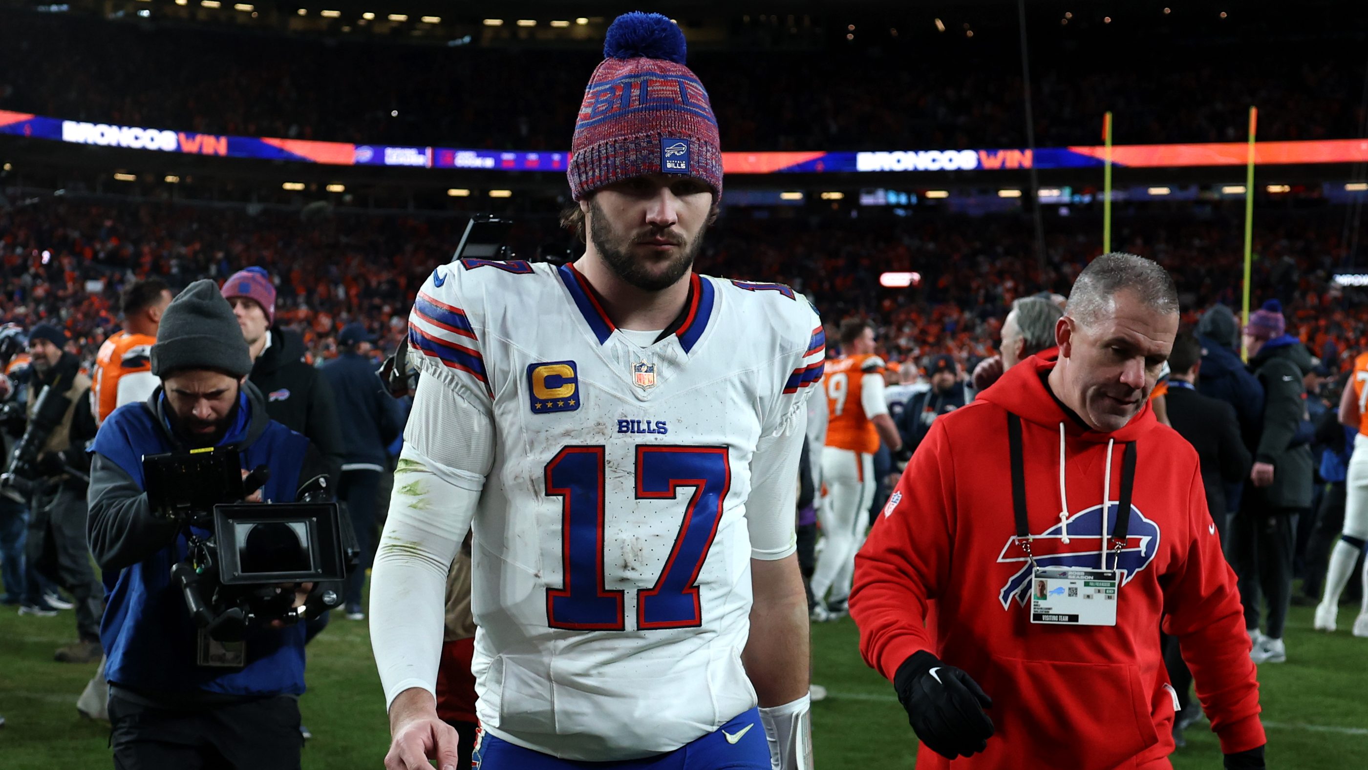 Josh Allen #17 of the Buffalo Bills walks off the field after being defeated by the Denver Broncos with a score of 30 to 33