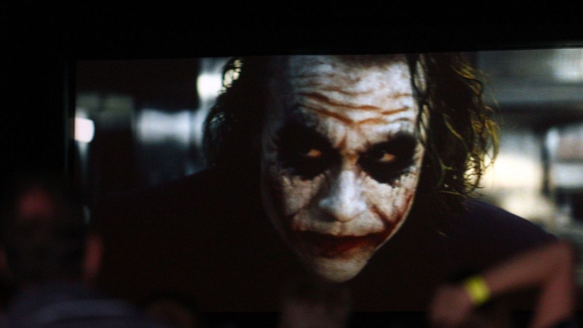 Film goers watch The Dark Knight featuring Heath Ledger during a public tribute outdoor movie night to the late actor at Burswood Park on February 12, 2011 in Perth, Australia. Australian actor Heath Ledger won a posthumous Oscar for his portrayal of the Joker in the movie The Dark Knight. Ledger died from an accidental toxic combination of prescription drugs on January 22, 2008