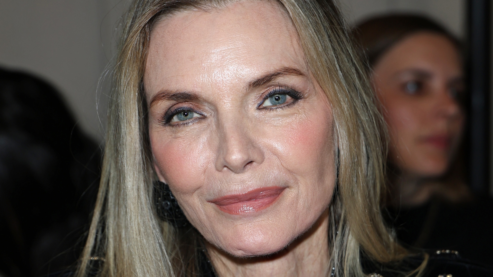 Michelle Pfeiffer poses for photos at fashion show