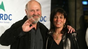 Rob Reiner waving and posing with wife Michele Singer