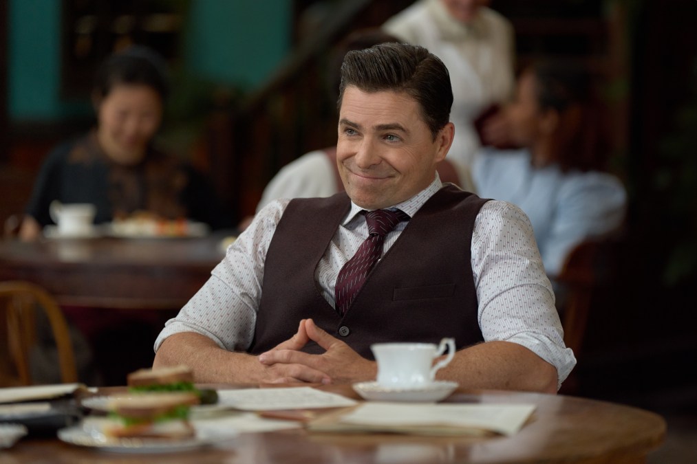 Kavan Smith smiling at table