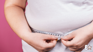 photo showing a woman with a tape measure
