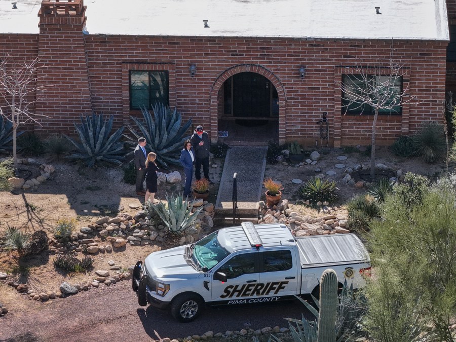 Law enforcement outside of Nancy Guthrie's home