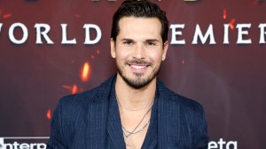 Gleb Savchenko smiling while he attends an event