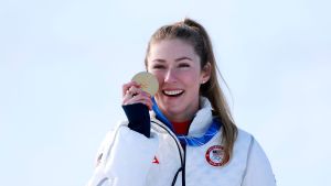 Gold medalist Mikaela Shiffrin of Team United States celebrates on the podium during the medal ceremony following the Women's Slalom Run on day twelve of the Milano Cortina 2026 Winter Olympics at Tofane Alpine Skiing Centre on February 18, 2026