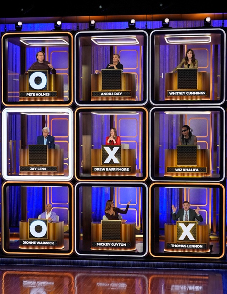 (L-R) Pete Holmes, Andra Day, Whitney Cummings, Jay Leno, Drew Berrymore, Wiz Khalifa, Dionne Warwick, Mickey Guyton and Thomas Lennon on “Hollywood Squares.”