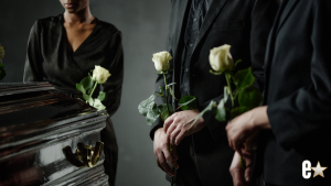 coffin with people at a funeral