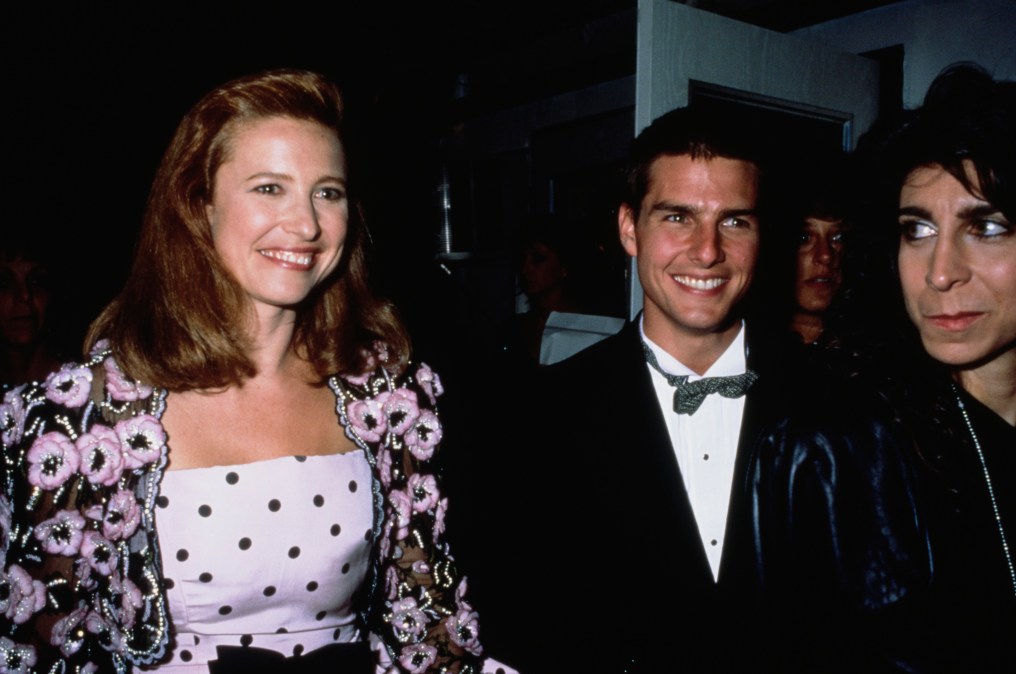 Tom Cruise and Mimi Rogers smile at an event