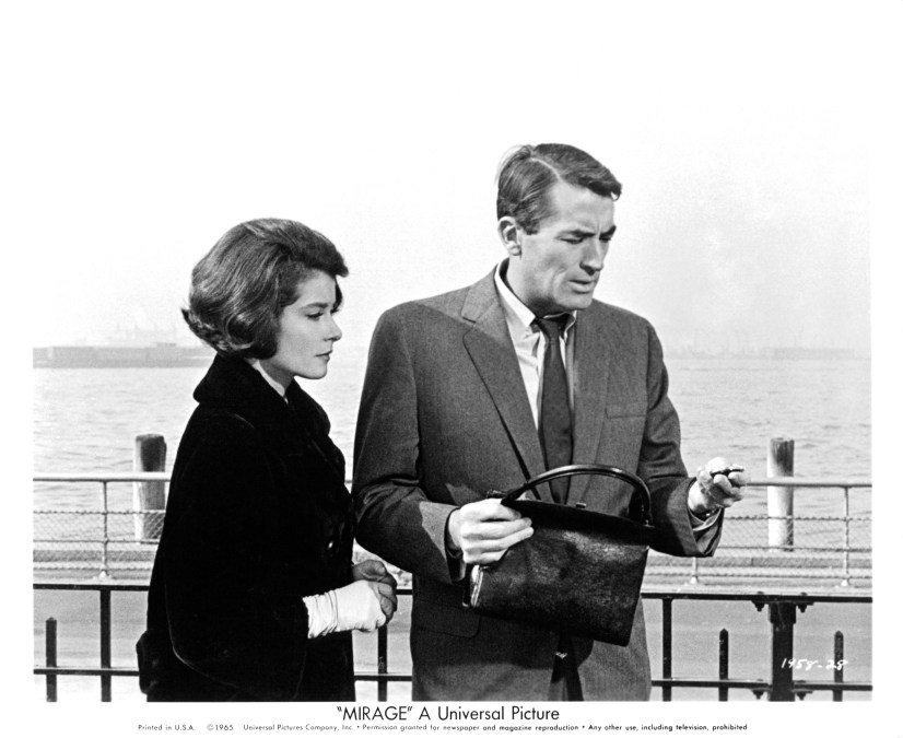 Actress Diane Baker and actor Gregory Peck on the set of the Universal Studio movie " Mirage" in 1958. 