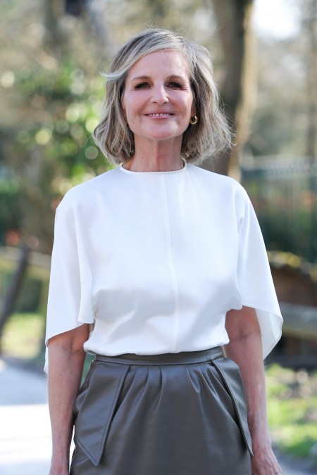 Helen Hunt smiling during Paris Fashion Week