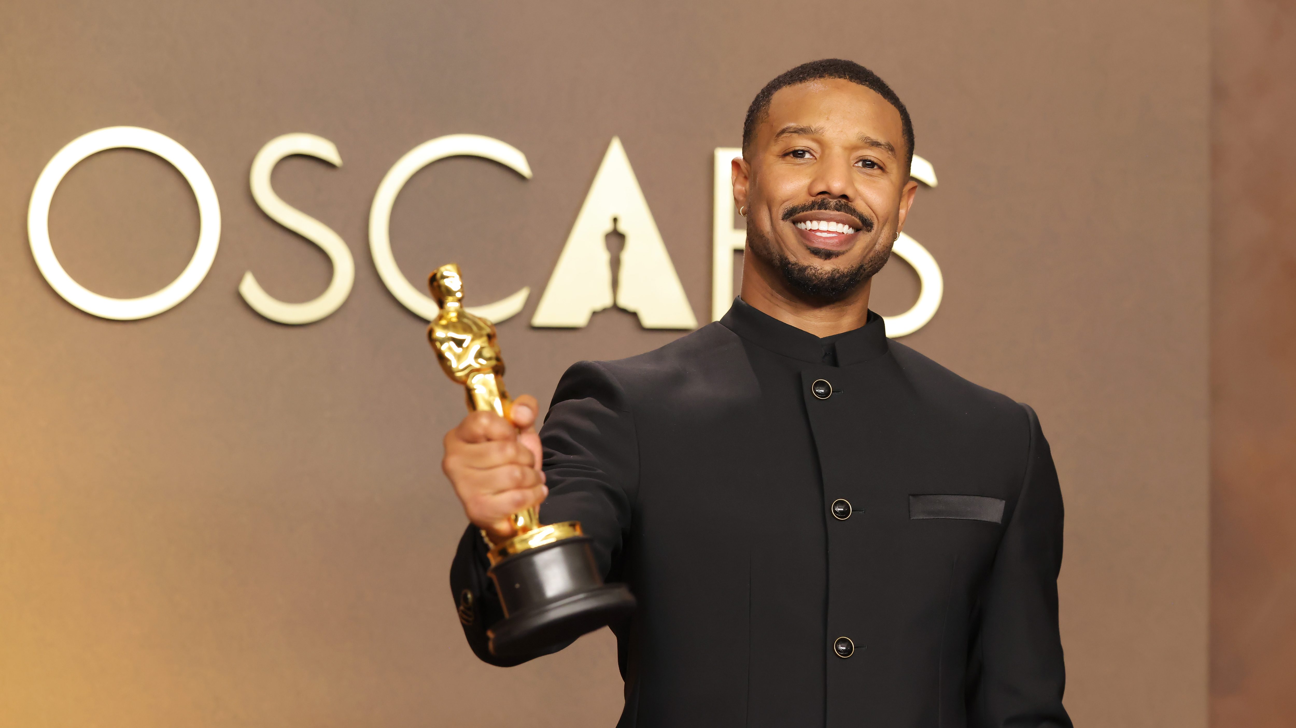 Michael B. Jordan holds Oscar