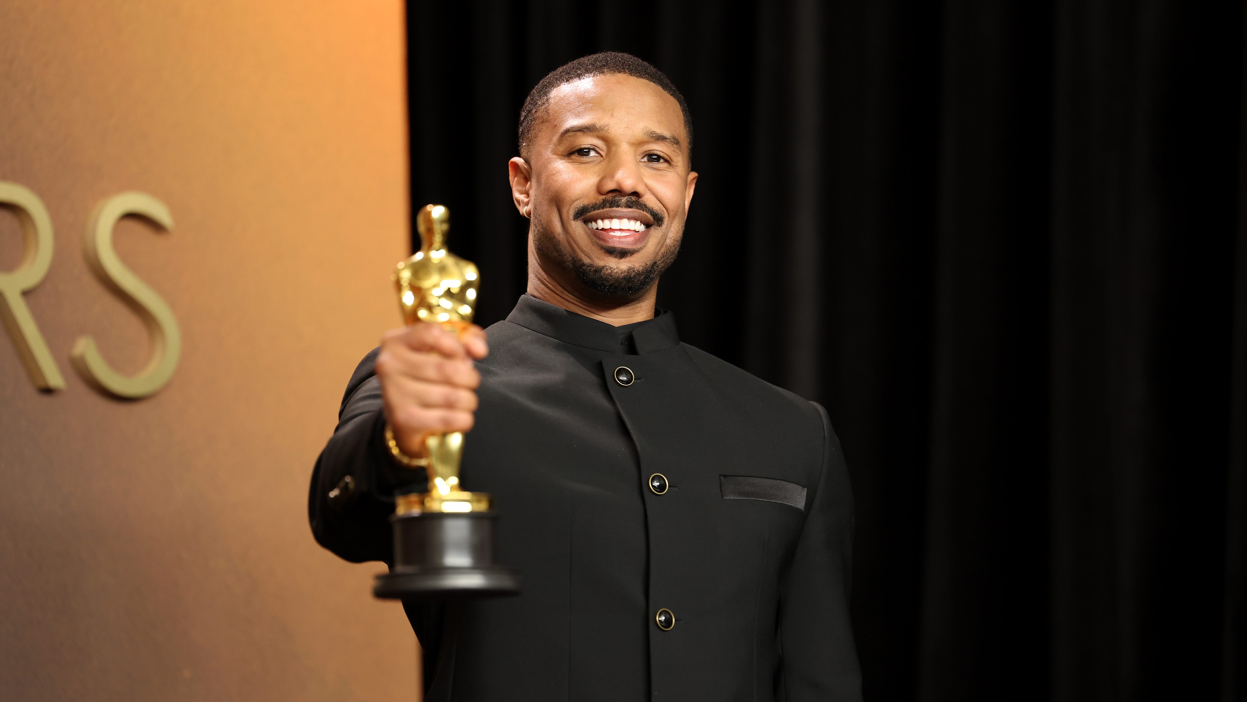 Michael B. Jordan with his Best Actor Oscar for "Sinners."