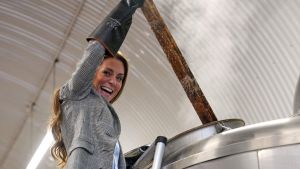 Britain's Catherine, Princess of Wales stirs in a brewhouse kettle as she tours the brewery during a visit of the Southwark Brewing Company at the Bermondsey Beer Mile on March 12, 2026 in London, England