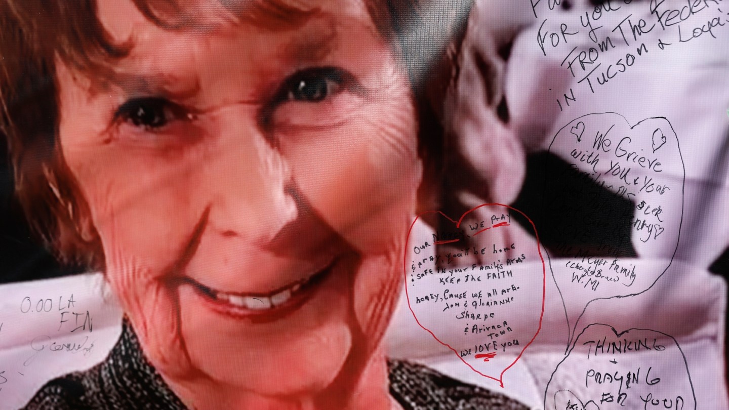 Public support for Nancy Guthrie and written messages on a poster