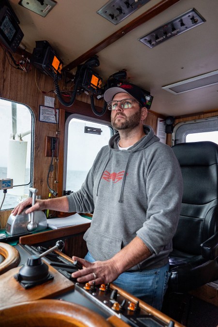 Captain of the Aleutian Lady Rick Shelford at the helm