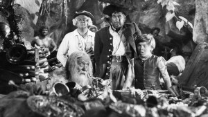 Bobby Driscoll and other stars in a scene from scene from "Treasure Island"