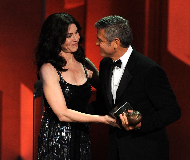 Actor George Clooney (R) accepts the Bob Hope Humanitarian award from actress Julianna Margulies