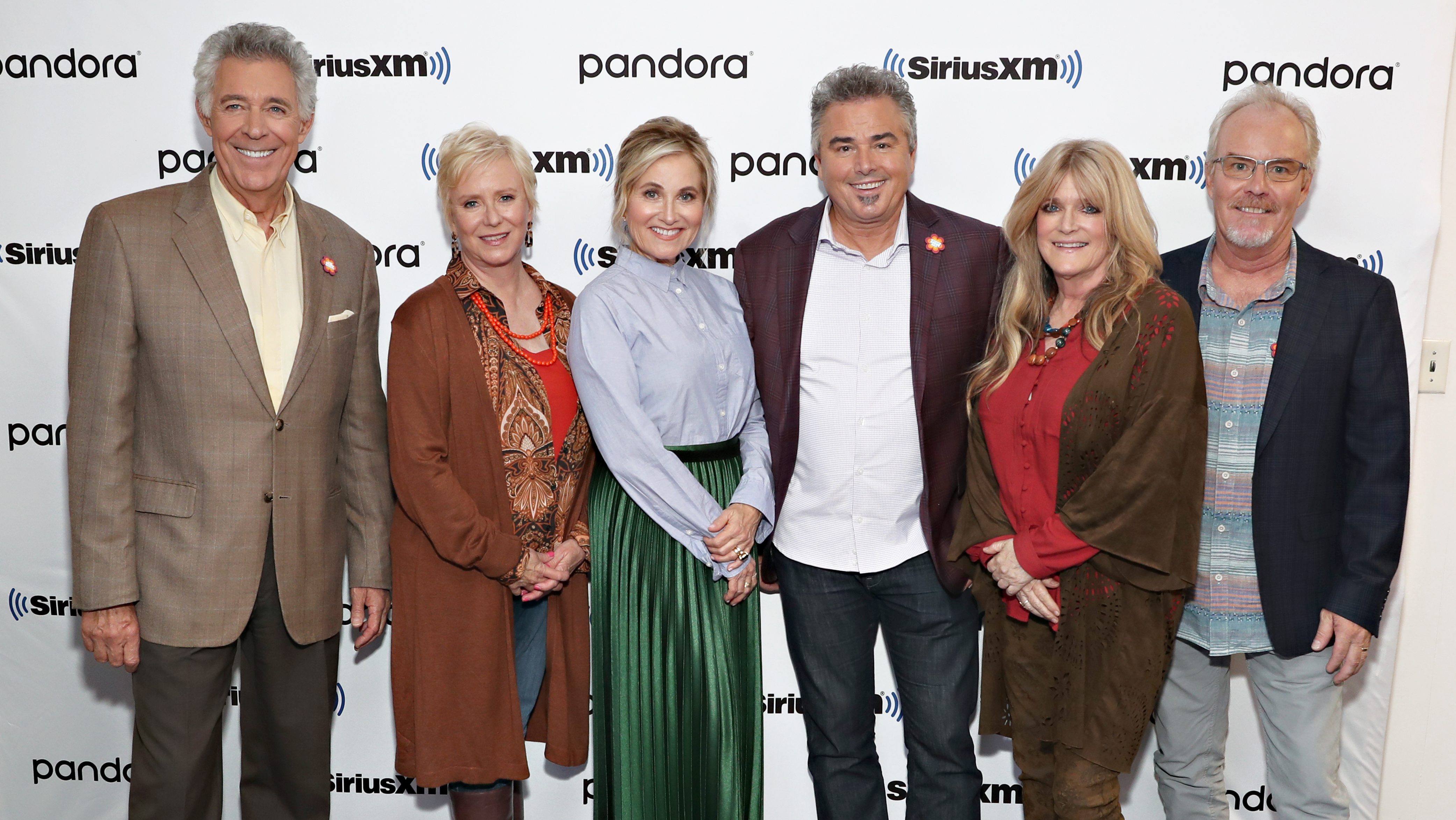 Barry Williams, Eve Plumb, Maureen McCormack, Christopher Knight, Susan Olsen and Mike Lookinland pose for a photo during Andy Cohen's Deep and Shallow interview special with the cast of The Brady Bunch.