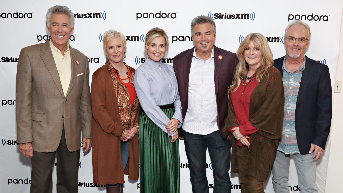Barry Williams, Eve Plumb, Maureen McCormack, Christopher Knight, Susan Olsen and Mike Lookinland pose for a photo during Andy Cohen's Deep and Shallow interview special with the cast of The Brady Bunch.