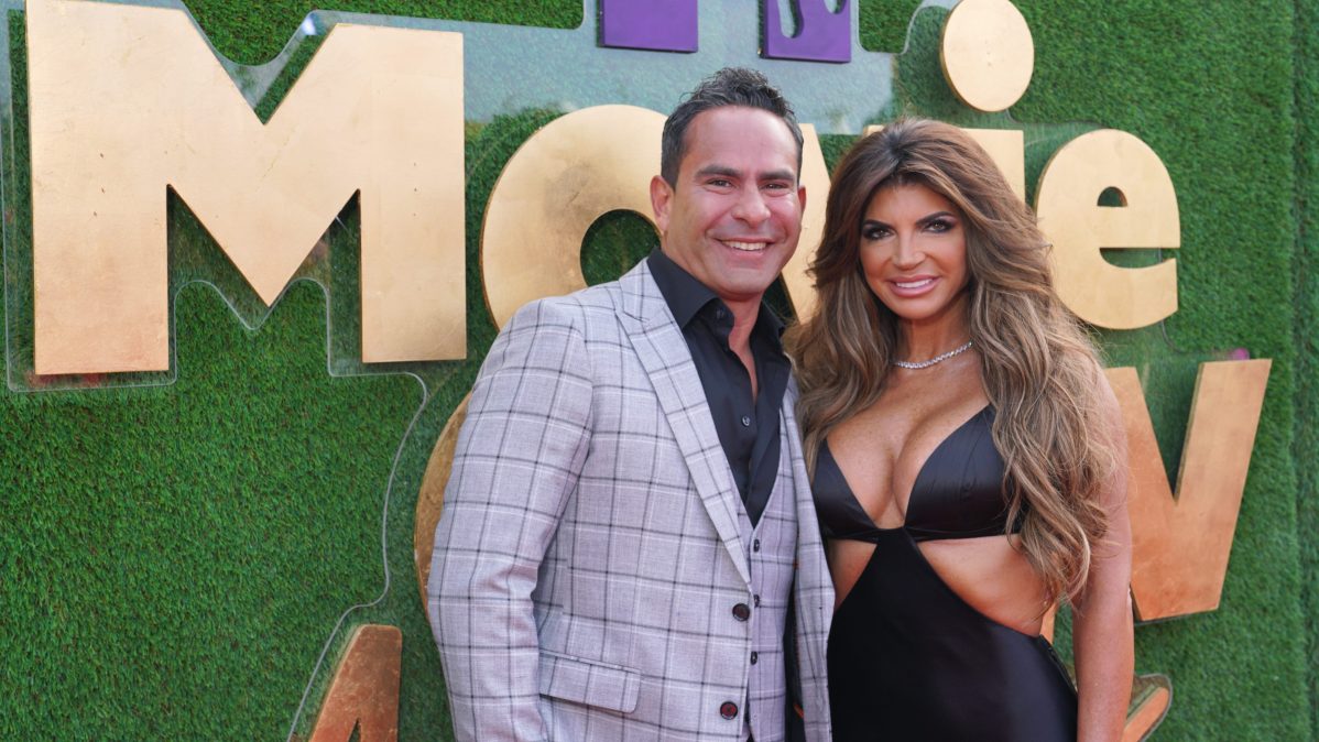 Teresa Giudice and Louie Ruelas pose together on the red carpet at the MTV Movie & TV Awards
