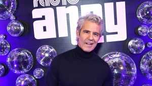 Andy Cohen poses at SiriusXM Radio Andy event surrounded by disco balls
