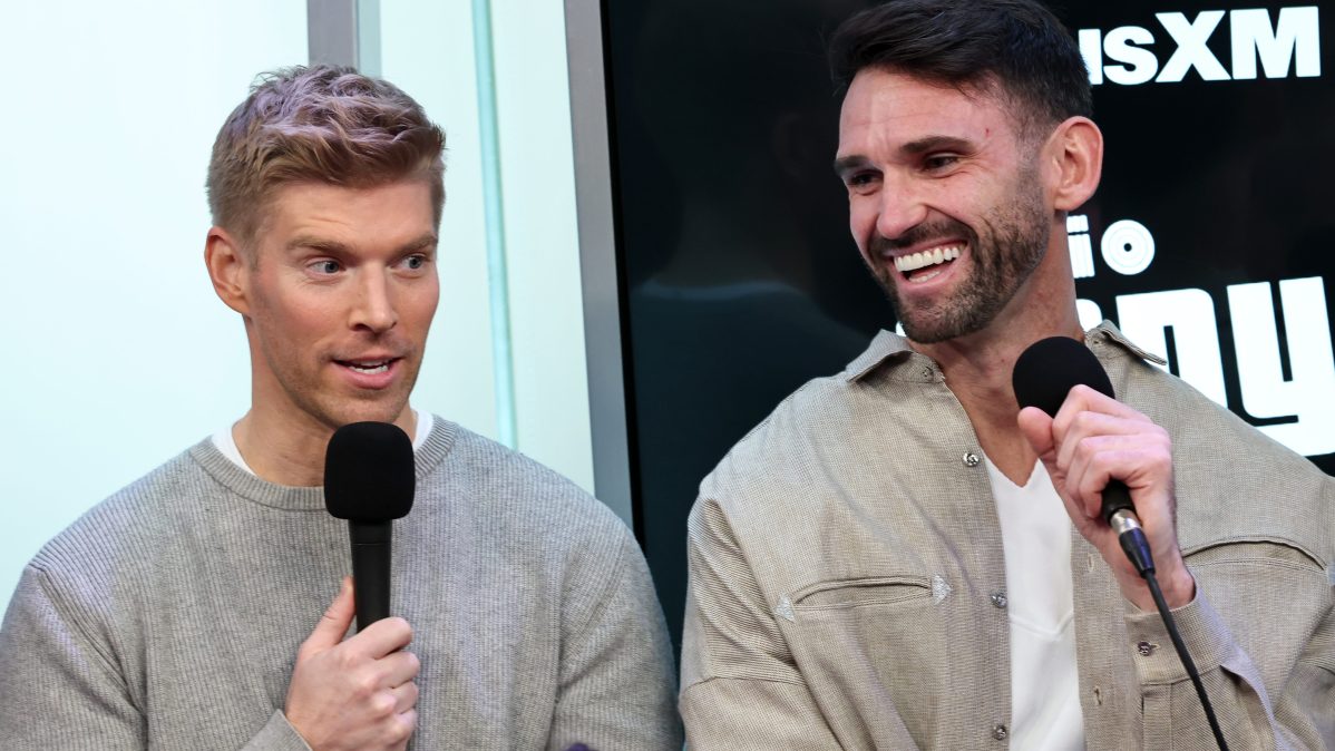 Kyle Cooke and Carl Radke speak into microphones during a SiriusXM &ldquo;Summer House&rdquo; event in New York City
